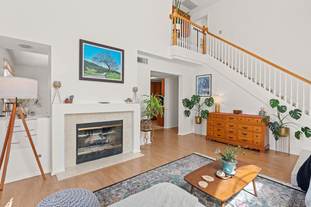 Updated end-unit in a prime Vista location! Freshly painted with vaulted ceilings and abundant natural light, this home features a spacious living area with gas fireplace, a roomy primary suite with arched window, and detached 2-car garage with direct access. Enjoy the convenience of the entry level bedroom and full bathroom, with two additional bedrooms and full baths upstairs. The kitchen offers plenty of storage looking onto the dining room and flowing out to your expansive private patio, with fresh landscaping and room to lounge—perfect for relaxing or entertaining. Community amenities include two recreation areas with pools, spas, lounge seating, restrooms, outdoor showers, and a clubhouse. Great location, with nearby restaurants, shops, schools, and the 78 freeway. Outdoor enthusiasts will love being minutes from Buena Vista Park, Calavera Reserve, and Vista’s growing downtown scene. Move-in ready and located in a mature, well-cared-for community—this one won’t last!