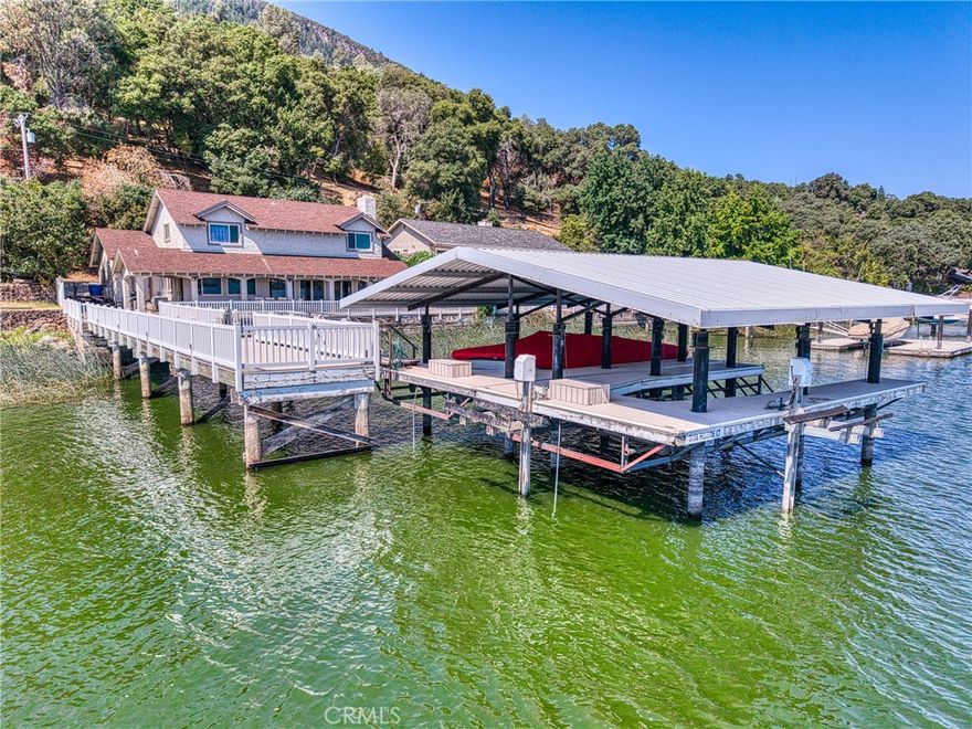 Beautiful Buckingham LAKEFRONT  Retreat – Private End-of-the-Road Location !!!

Nestled in one of Lake County’s most desirable areas, this spacious 4-bedroom, 3-bath lakefront home offers stunning views of the LAKE AND MOUNTAINS  and offers exceptional privacy at the quiet end of the road. The family-style, eat-in kitchen, open concept dining room, and inviting living room with a fireplace provide the perfect setting for gatherings. A wall of glass windows frame sparkling LAKE views, while upgraded window coverings add style and comfort. One bedroom is conveniently  located downstairs, with three more bedroom  upstairs, each filled with  natural light. The main-level bathroom has been recently remodeled with tasteful finishes. 

Interior upgrades include a dual-level energy efficient  AC/Heating system and a new water heater, premium double pane windows/sliding glass doors.  Exterior has  significant upgrades, including a replaced roof, durable  stucco finish for long lasting beauty and very low-maintenance grounds.  Expansive outdoor areas are ideal for BBQs, entertaining, or simply relaxing by the LAKE. An extra-large , fully lit 10' x 80' pier  leads  to a deluxe boat dock facility featuring two covered boat lifts with steel pile supports, individual electric lifts with remote controls, plus an independently operated jet ski lift.

A two-car attached garage offers ample storage, with additional outdoor space for parking boats and lake toys completes the package.  Low cost HOA fees include access to the clubhouse, boat launch, private marina, golf course.  This home offers comfort, modern upgrades, and the ultimate lakefront lifestyle in the sought after Buckingham location.  Impeccably maintained , with pride of ownership is evident throughout. (age,sqf,property lines, not verified by agents/Tax records show 3 bedrooms)