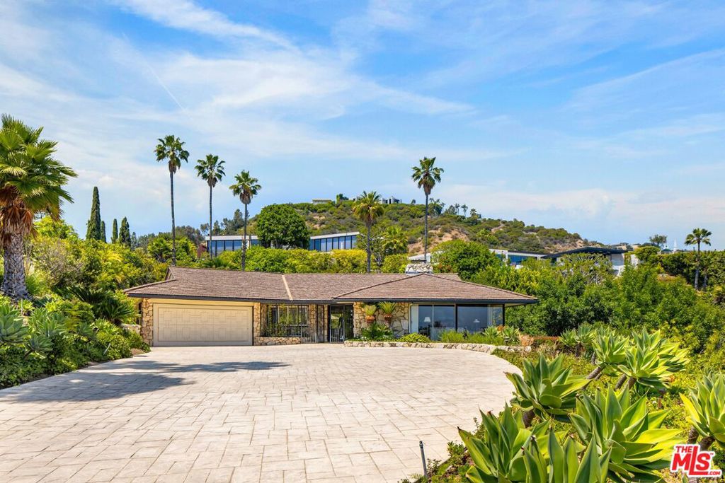 TRUST SALE - Positioned on an oversized 35,829 sq ft lot (over 0.82 acres) across two legal parcels in Beverly Hills' exclusive Trousdale enclave, 1080 Wallace Ridge is one of the last remaining properties of its kind- offering architectural character, sweeping city to ocean views, and exceptional development potential. Surrounded by landmark estates including 1108 Wallace Ridge (currently listed at $53 million) and others that have sold between $40M and $60M- the property's immense upside is undeniable. The existing 3-bedroom, 3-bathroom mid-century residence is thoughtfully arranged in a wide U-shape around a sun-soaked courtyard and classic pool. Design features include expansive glass windows, a stone fireplace, original built-ins, and seamless indoor-outdoor flows. The gently tiered lot and second parcel offer flexibility for expansion, redesign, or new construction- mirroring the approach behind the area's most notable estates. Held by the same family for over five decades, this is a rare opportunity to own a timeless Trousdale original or create a new legacy estate on one of the neighborhood's most coveted streets. A recent survey has been conducted on the property and is available upon request via email.