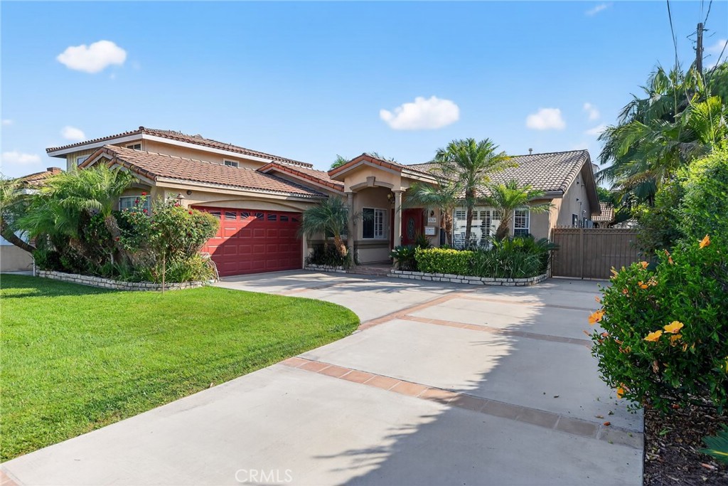 This house has 4 Bedrooms: three of them with engineered wood floor and one with black granite floor like the rest of the house; the owner's bedroom is huge and has a large walking closet and the bathroom has two sinks. There are 3 bathrooms, two of which were fully updated recently and one partially updated. Total living area approximately 2615 sqft, large family Room with fireplace, Living Room, Dining Room and Kitchen with new ovens and a Viking 6 burner gas Range. The exterior includes a patio, pool, BBQ covered area, pergola, some fruit trees, a long driveway for RV or 6 vehicles and tile roof.