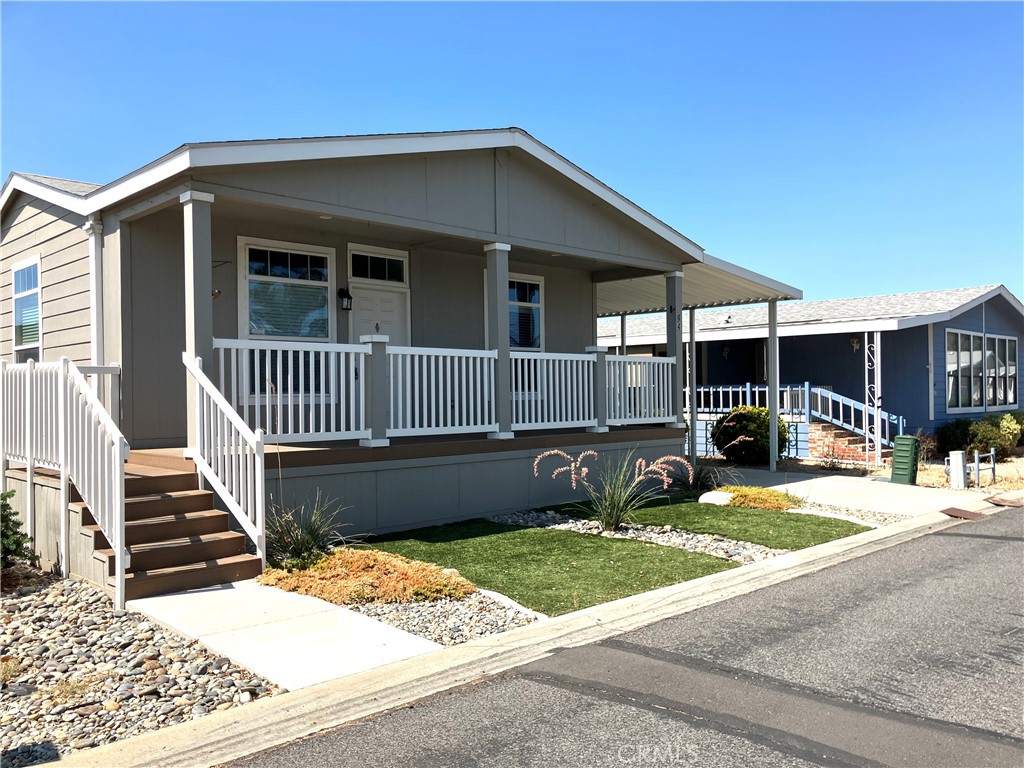 WELCOME HOME SENIORS....HEATHER ESTATES is one of the finest senior communities in all of Hemet....Here we present to you a 2018 3 bedroom 2 bathroom home that is like brand new...Turnkey and ready for it's new owners...The home is stunning and has the open concept that everyone is searching for...It's light and welcoming and the front porch is such an awesome feature...A great place to enjoy the gorgeous mountain views and meet your neighbors (or your cup of coffee)...There is a wonderfully cozy clubhouse with all the amenities and a swimming pool and lake right behind it...there is also a nice green space for walking your fur babies....This is a great time to purchase a home before interest rates fall and prices go higher...This is a gated community 24/7 for your security and peace of mind...Lot rents and taxes are still low so let's get going !!! Call today for your free tour !!!