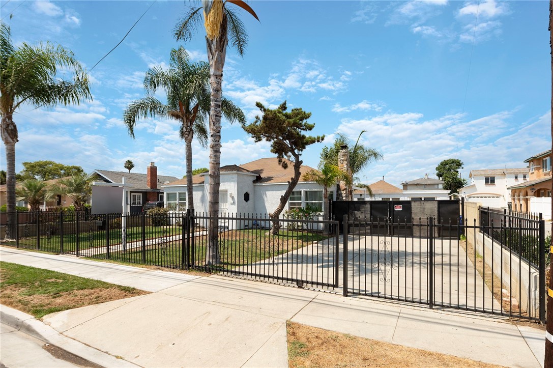 Located in the heart of Bellflower, this beautifully updated duplex presents a rare opportunity for both seasoned investors and owner-occupants seeking added income or flexible living arrangements. Set on a sprawling 16,507 sq. ft. lot, the property is fully gated with elegant iron fencing, offering both security and curb appeal. Both units have been thoughtfully remodeled, move-in ready with modern finishes. The front unit offers 2 bedrooms and 1 bathroom, with its own private entrance and inviting curb presence. An extra-wide, extended driveway leads to the rear unit, which features 1 bedroom, 1 bathroom, and a private 1-car attached garage. The expansive rear portion of the lot remains open, presenting a blank canvas for future development (buyer to verify with the City of Bellflower). Don’t miss out on this great investment opportunity in one of Bellflower’s most desirable neighborhoods.