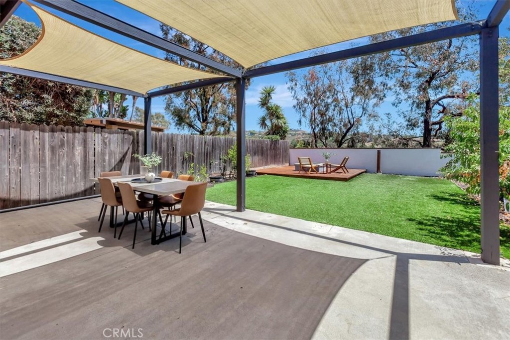 Upgraded Home with Expansive Backyard in Tocayo Canyon – Cul-de-Sac Location! Welcome to this beautifully upgraded 2-bedroom, 2.5-bathroom home located in the highly desirable Tocayo Canyon community of Forster Ranch, San Clemente. Perfectly situated on a quiet cul-de-sac, this charming residence combines comfort, style, and one of the largest backyard spaces in the neighborhood. Step inside to discover new luxury vinyl plank flooring throughout, an open-concept kitchen with soaring ceilings, granite countertops, a classic subway tile backsplash, and upgraded cabinetry. A Reverse Osmosis system is installed under the kitchen sink for clean, filtered drinking water. French doors off the kitchen lead directly to the backyard, creating a seamless indoor-outdoor flow ideal for entertaining. All bathrooms feature new vanities, and the spacious primary suite includes a walk-in closet and a newly tiled shower. Enjoy your private backyard retreat, complete with a large covered patio, concrete and artificial turf areas, a raised deck with a cozy fire pit, and fruit trees lining the side yard. Recent updates include a brand new roof installed in 2025 and a freshly repainted exterior, giving the home a clean look. Additional features include a two-car attached garage and convenient community parking for an RV or boat. Located just steps from the greenbelt, award-winning schools, and some of the best hiking and biking trails in Orange County—this move-in ready home offers the very best of the Forster Ranch lifestyle.