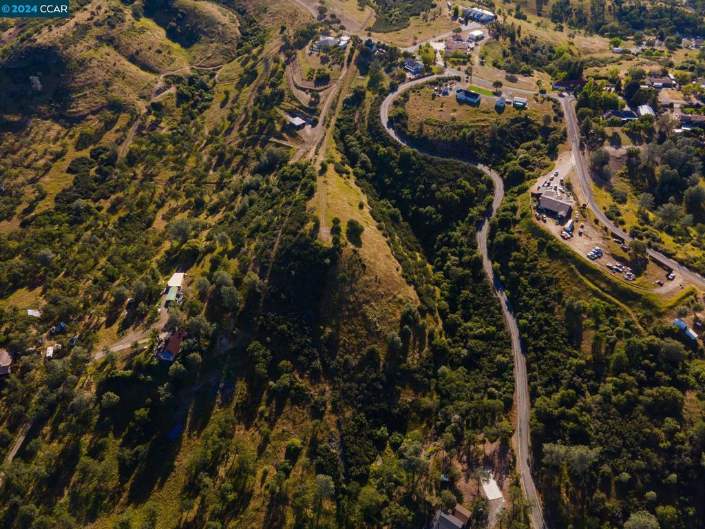 This lot has an amazing 360 degree view of the Central Valley up to Lake Camanche and into the Sierra's from the 4.7 acre parcel. Owner has cut a road into the building site and profiles for the septic were done about 5 years ago. Public water and power is close by on Ross. 30ft easement road to access property. Entrance at the end of Ross.