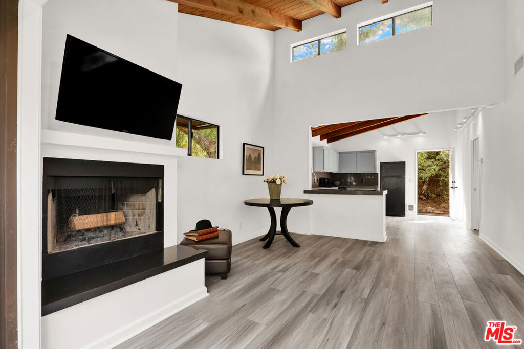 Located in the Desired Climate Perfect Fernwood area of Topanga Canyon. This Private 2 Bedroom, 1 Bath Home is part of a Large Estate and Features High Beam Ceilings, Open Floorplan, New Kitchen Countertops and a Fireplace in the Living Room. Enjoy a Private Laundry Area with Full-Size Washer and Dryer. Relax on your own Private Decks and Private Back Yard with Overhanging Trees & Fresh Ocean Air with Morning Fog. Central Air & Heat, Dishwasher, New Floors and Plenty of Parking.