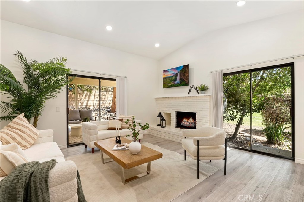 Welcome to your serene Claremont retreat! Tucked away at the end of a peaceful cul-de-sac and just moments from the Claremont Tennis Club, this beautifully maintained single-story home offers 2 bedrooms, 2 baths, and 1,122 sq. ft. of inviting living space. Perfectly combining comfort, style, and convenience, it’s an ideal haven for those seeking both relaxation and accessibility. Step inside to a bright, airy living room with soaring ceilings, abundant natural light, and a cozy fireplace—perfect for gatherings or quiet evenings in. True newer luxury vinyl plank flooring flows throughout, complemented by freshly painted walls and doors for a crisp, updated feel. The open-concept kitchen features garden views from its sunny windows, a gas cooktop and oven, and generous counter space. Adjacent, the dining area is ready for everything from casual meals to dinner parties. The spacious primary suite is a true retreat with vaulted ceilings, a triple-door mirrored closet plus an additional storage closet, and a private ensuite bath complete with dual sinks, a soaking tub, a walk-in shower, and a separate walk-in closet. The secondary bedroom is equally inviting, filled with natural light and ample space. Step outside to enjoy two private patios—one covered for year-round dining and entertaining, and another perfect for relaxing amid lush landscaping. The low-maintenance backyard with artificial turf ensures more time for enjoyment and less time on upkeep. Additional highlights include a hall bath with a shower-over-tub combination, a two-car direct access garage with abundant storage, and a prime location close to the Claremont Colleges, Claremont Village, shopping, dining, and major freeways. This home offers the perfect blend of tranquility and convenience—don’t miss your chance to make it yours!