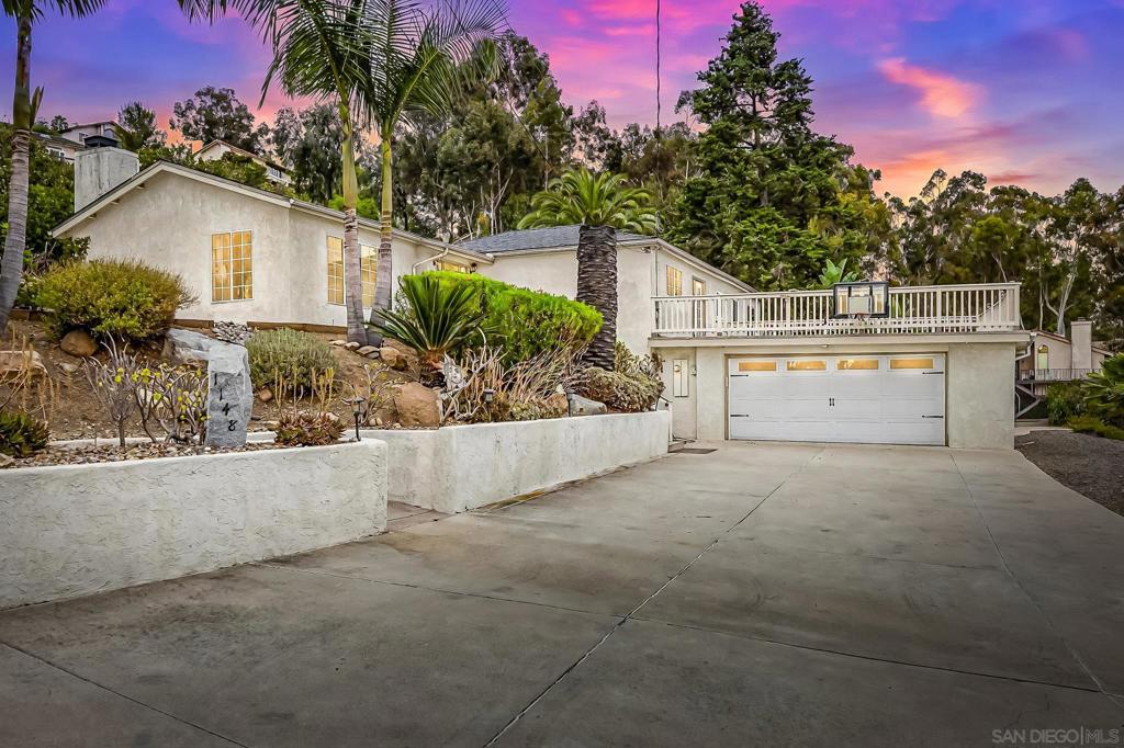 Welcome to this stunning 4-bedroom, 2-bathroom home boasting 2,180 sq ft of living space and situated on a massive 1.2-acre lot with truly breathtaking panoramic views of the El Cajon Valley. Whether you're soaking in the sunrise or watching the city lights come alive at night, the scenery here is nothing short of spectacular. Inside, you’ll find brand new carpet in the living room and bedrooms, fresh exterior paint, and a dramatic vaulted ceiling in the living room anchored by a gorgeous stacked stone fireplace perfect for cozy evenings or entertaining guests. The oversized 2-car garage includes a bonus room/office, a full bathroom, and extra storage, offering great flexibility for remote work, hobbies, or even guest accommodations. Outside, there’s room for RV and boat parking, plus plenty of space for all your toys, trailers, or future plans. Enjoy the freshly turfed and fenced play area, raised planter boxes, and your own small greenhouse—ideal for those with a green thumb or anyone looking to live the outdoor lifestyle. With its unbeatable combination of space, views, and versatility, this El Cajon gem is a rare find. Come see the potential and make it your own!