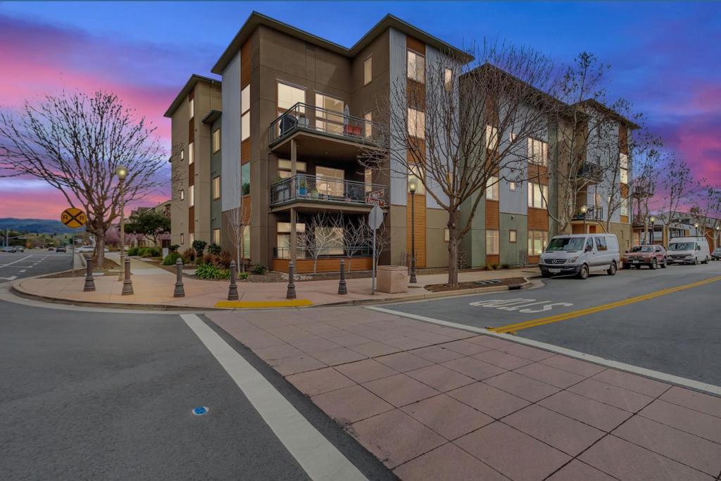 Wait until you see the terrace! This single level condo is one of only two units in Barley Place that boasts a supersized deck with over 10' X 32' of outdoor space. If you're thinking about enjoying the vibrant downtown Morgan Hill lifestyle, then this amazing location in Barley Place could be the opportunity. These condos don't come on the market very often & you'll see why once you explore what's outside the door. It's a front row seat to the Farmer's Market, Friday night music series, Kelly Brewing, Hop Shop, Depot Street Pizza, Odeum, MoHi Farm, cool boutiques, festivals, Caltrain station, tech shuttles & more. This 7 year old luxurious end unit offers an entry foyer, huge great room, 10' ceilings, recessed LEDs, plantation shutters, quad pane windows, plank style flooring, gorgeous kitchen, & a terrace with great views that's so big it's worth mentioning twice! You'll also enjoy a kitchen pantry, laundry closet with side-by-side washer/dryer, & a deck storage closet that's about 45 SqFt. Plus there's a building elevator so this unit has the EZ access of a flat single story. Located next to the historic Granary building, this complex was beautifully designed by Weston Miles Architects as a CalGreen Platinum Level project with efficiency & sustainability in mind. Welcome home!