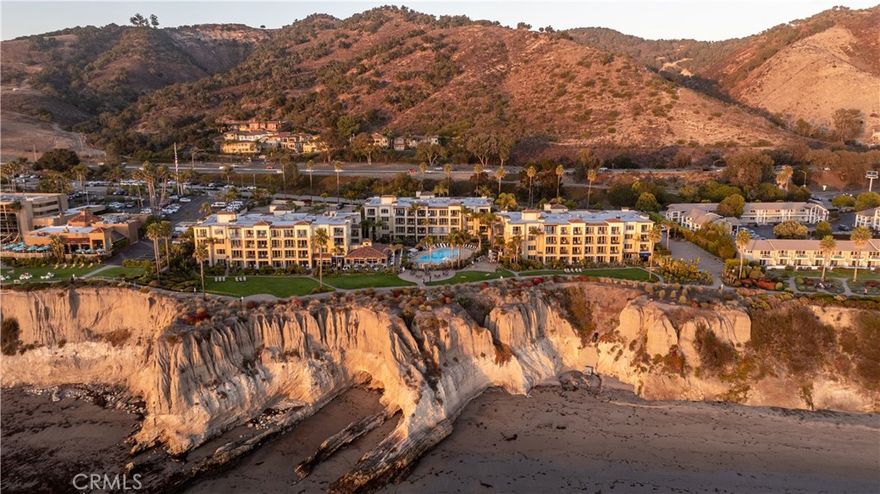Experience the essence of refined coastal living in this elegant luxury condominium located within the renowned Dolphin Bay Resort. Perched atop the scenic bluffs of California's Central Coast, this residence offers a rare opportunity to own a resort-style home with access to world-class amenities and services. This single-level suite welcomes you with custom travertine stone flooring that flows throughout the space. The gourmet kitchen is outfitted with granite countertops, stainless steel appliances and custom wrap-around cabinetry, creating both beauty and function. The kitchen opens to an open dining area, making the space ideal for relaxed entertaining. Through large sliding doors, you'll find a fully glassed-in deck, perfect for enjoying a glass or wine and taking in incredible Shell Beach sunsets. The spacious living room features a updated fireplace, recessed ceilings, and a built-in entertainment alcove, offering a warm and stylish space to unwind. The generously sized bedroom provides a peaceful sanctuary, with easy access to the beautiful bathroom with ample lighting. Upgrades include recently installed canned lighting in the kitchen, electrical upgrades though out the suite, newly installed electric fireplace, ceiling fans, and more. As an owner at Dolphin Bay, you’ll enjoy the benefits of four-diamond resort services: room service, concierge, world class spa services and house keeping services(fees apply). Amenities include a heated pool and hot tub with poolside service, fitness center, oceanfront lawn, BBQ area, fire pit, and beautifully manicured grounds. Dining at the award-winning Lido Restaurant and relaxing at the on-site spa complete the luxurious experience. HOA dues cover cable, water, gas, trash, maintenance, internet, cable TV and full use of all common areas and amenities, making ownership seamless and hassle-free. This unique opportunity offers the option to participate in the resort's rental pool program, which gives you the flexibility to generate income without the headache of managing the property. Whether you're seeking a personal sanctuary or a smart investment opportunity, this extraordinary suite offers the ultimate in Central Coast lifestyle and luxury.