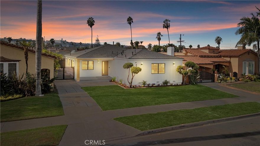 This completely redesigned and remodeled single-story home offers luxurious finishes throughout. Hard wood floors greet you as you enter the living area of a light and bright open floor plan. Enjoy dinners in your lovely dining room, conveniently situated next to the kitchen. This kitchen screams sophistication with sleek flat panel cabinets, quartz countertops, a walk-in pantry, 9 ft. waterfall island with chic pendant lights, a stunning backsplash, and stainless-steel appliances that are all included! Relax in the living room featuring an eye-catching accent wall and french doors with access to the backyard. Down the hall is a powder room and a separate laundry room with a washer, dryer and ample cabinet storage. This home offers 4 bedrooms including 2 primary suites, all with direct bathroom access. The first primary suite is the largest with french doors that open to the backyard, and an ensuite bathroom that is to die for. This bathroom has elegant tilework throughout, a dual sink flat panel vanity with quartz countertop, free-standing tub, magnificent walk-in shower, and a spacious walk-in closet. The second primary suite has a unique fireplace, preserving a piece of the home’s original charm. Its ensuite bathroom has a beautiful tile walk-in shower, tile floors, and a flat panel vanity with quartz countertop. A Jack & Jill bathroom sits between the 2 remaining bedrooms with an alluring accent wall, flat panel dual sink vanity and a divinely tiled tub/shower. A detached garage is at the rear of the home and is equipped with an electric car charger and epoxy floor and can be converted to ADU. The backyard has a new deck and enough room for kids/pets to play comfortably. This property is as close to a new built home as you can find, taken down to the studs and completely refinished (with permits). Come fall in love with it today!