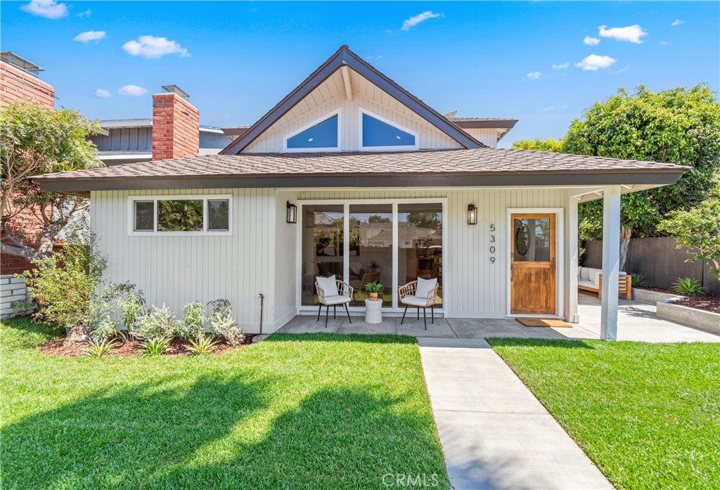 Welcome to this beautifully renovated coastal retreat, where timeless charm meets modern comfort. Step through the brand-new Dutch door and into soaring wood-beamed ceilings, expansive windows, and sunlit open spaces designed for effortless indoor-outdoor living. The inviting living room, anchored by a cozy gas fireplace, flows seamlessly into the dining area and a stunning remodeled kitchen. Featuring quartz countertops with a dramatic waterfall peninsula, cream cabinetry, modern appliances (including a wine/beverage fridge), and a walk-in pantry, this kitchen is as functional as it is stylish—perfect for entertaining or everyday living.
Just outside, enjoy the private side patio, ideal for al fresco dining, and the newly landscaped yard complete with lush grass and a custom wood fence—your own private oasis. The home’s curb appeal also shines, with handpicked landscaping and a welcoming coastal aesthetic.
Downstairs, you’ll find a beautifully updated full bath with a designer West Elm vanity and a spacious bedroom with a walk-in closet. Upstairs, another sun-drenched bedroom offers water views, alongside a fully remodeled bathroom with a custom dual-sink vanity and walk-in shower with dual shower heads. The true showpiece of the home is the expansive primary suite, complete with a sitting room/office with double doors leading to the beautiful bedroom with double-door closets and a private balcony with peek-a-boo water views.
The two-car garage is a blank canvas for storage or parking, with new washer/dryer hookups and a brand-new garage door, plus parking for two more in the driveway. Additional upgrades include: new high-end laminate flooring throughout, new HVAC, new permitted electrical panel, new water heater, dual-pane windows and sliding doors, all new interior doors, powder-coated stair railings, fresh new interior/exterior paint, new concrete patio, and more!
Located just steps from the beach, Mother Beach's playground, Marine Stadium’s farmers market and summer concerts, and minutes from Belmont Shore’s shopping and dining, this home offers the best of coastal living—plus it’s walking distance to top-rated schools and the future site of the 2028 Olympics. Don’t miss this amazing opportunity!
