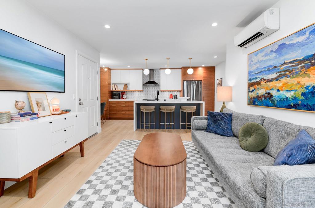Welcome to this beautifully renovated condo in the highly sought-after Pacific Pines community in Encinitas! This stunning one-bedroom condo has been fully remodeled with high end upgrades throughout. The open-concept design showcases a modern kitchen with a large quartz island (with outlets), quartz countertops, custom designer cabinets, stylish backsplash, new appliances, upgraded lighting fixtures and hardware. Luxury vinyl flooring runs throughout, and the bathroom has been tastefully redone. Additional highlights include washer/dryer, custom built-ins in the walk-in closet, and a mini-split AC systems in the living room and bedroom for year-round comfort. Sound insulation has also been added to the ceiling and walls, creating a peaceful retreat. A charming fireplace and private patio complete a cozy, welcoming feel. Storage and one assigned parking space are also included. Residents of Pacific Pines enjoy an impressive array of amenities: tennis courts, pool, spa, fitness center, racquetball, pickleball and volleyball courts, guest parking, EV charging stations, and scenic nature trails. The location offers easy access to Cardiff, MiraCosta College, beaches, freeway access, and all the vibrant coastal lifestyle Encinitas has to offer. Don’t miss the chance to own this special gem in one of the most desirable coastal communities!