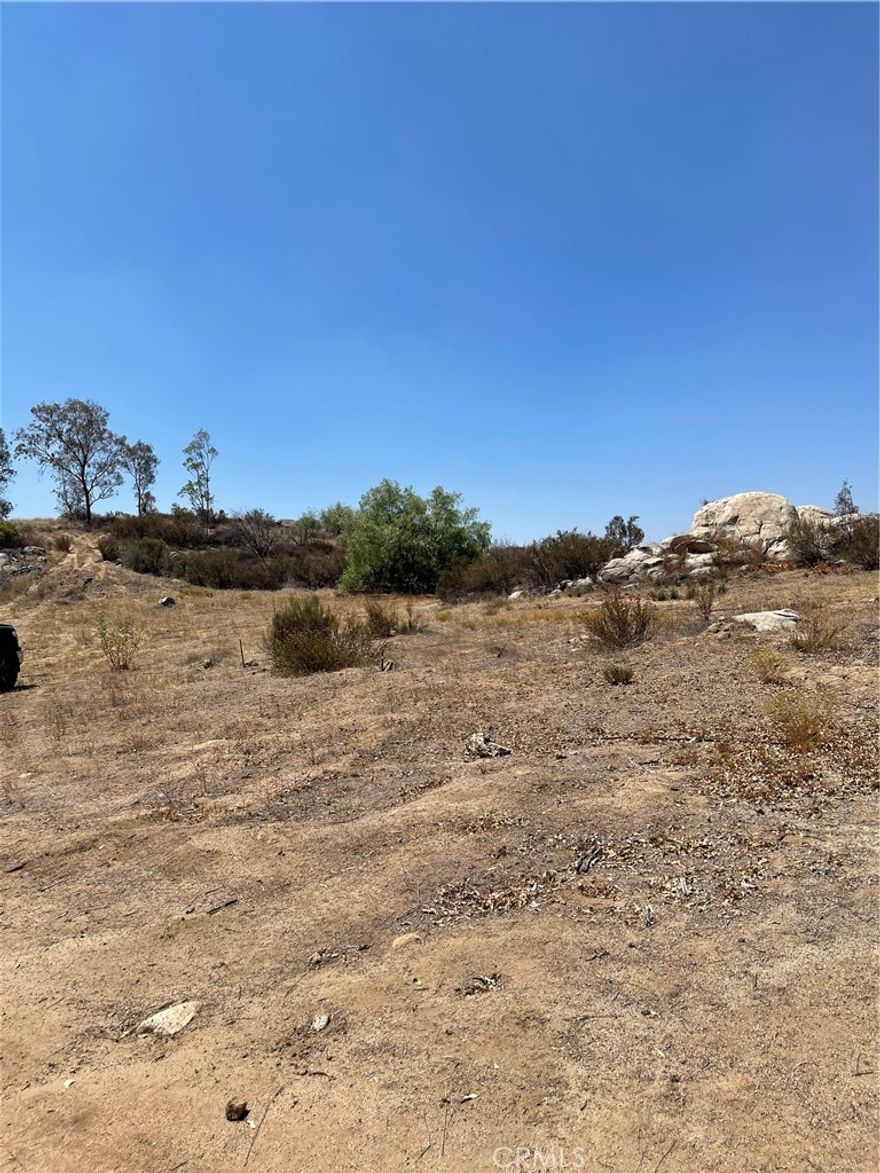 Gentle rolling 19.85 acre in area loaded with oaks & willows, has a rural country environment, area is a mix of custom/manufactured homes, lots of privacy amid country living at its finest. Close to Diamond Valley Lake & Golf Course, Temecula Valley Vineyards & Wineries, Pechanga Casino, Soboba Casino.
