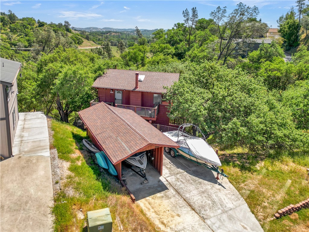 This is the quintessential AND affordable lake cabin you've been looking for all these years! Located in the private gated community of Oak Shores on Lake Nacimiento’s scenic north shore. This rustic yet upgraded home features a gorgeous new kitchen remodel, vinyl plank flooring, a wood-burning fireplace, and 2 spacious bedrooms each with their own deck and 1.5 baths. There is also a flex room to be utilized as an office or game room? Enjoy distant views from the all four decks! Recent mechanical upgrades include a new HVAC system and tankless water heater as well! Enjoy all the Oak Shores amenities included in the HOA; clubhouse, pool, marina and launch ramp, playgrounds, dog park, mini-golf, and West Ramp if you just want to hang on the Beach! Whether you're looking for a full-time residence, vacation home, or short-term rental opportunity. This property offers comfort, substantial upgrades yet still potential to make it your own for that laid-back lake lifestyle you've been dreaming of!