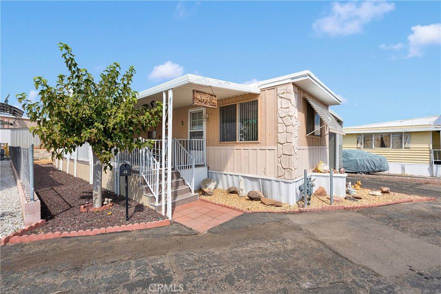 Charming and affordable modular home located in a well-maintained 55+ park with land lease. Enjoy the spacious covered porch and carport that run the full length of the home—perfect for relaxing outdoors. This updated and well-cared-for unit is move-in ready. Holiday Homes community offers great amenities including a recreational area, swimming pool & Dog Park, providing plenty of opportunities to socialize and stay active or just have a peaceful place to live. Lot rent is $515/per month*. Park approval is required for all buyers. Please call Brianna or Julie at 760-252-3511. Financing available on approved credit (OAC).