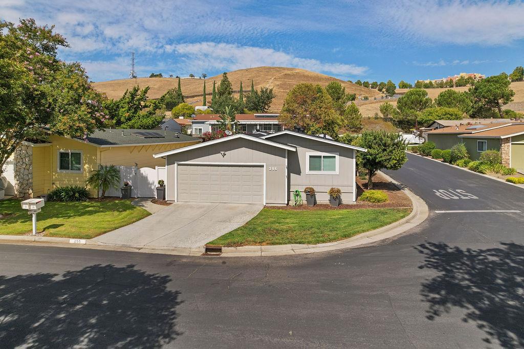 This mobile home is calling your name. Welcome to Mountain Springs a premier mature adult mobile home community. Purchaser must be owner occupied, no sub-leasing, one buyer age 55+, and no permanent resident under 18. The community maintains the front yard. Situated in a quiet corner with no neighbors on one side & no one in front. Beautiful view to mountains and ducks in the creek. Two-car attached garage + room to park in front & near guest parking. Behind your private fence yard, relax and rest patio or raised deck, while enjoying a competitive game on your own private bocce ball court. . Meander inside taking in the high ceilings, recess lights, and double-pane windows. Luxury laminated floors, granite countertops, stainless steel appliances, gas range, central a/c, and generously sized rooms. The oversized indoor laundry room also offers a desk space also enjoy your remodeled garage with epoxy floor. In 2024 lighting and plumbing were updated. So much to offer for an affordable home in Silicon Valley.