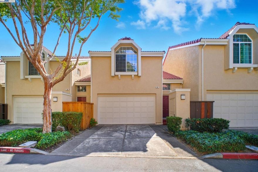 Welcome to this beautiful north-facing 2-bedroom, 2.5-bath townhome, freshly painted and featuring brand-new SPC flooring throughout. Ideally situated in a premium Fremont neighborhood within the Washington High School attendance area (buyers to verify enrollment), this home combines comfort, style, and convenience. The remodeled kitchen impresses with soapstone countertops, a sun-filled breakfast nook, a center island, and a stainless-steel gas range/oven — perfect for everyday cooking or entertaining. The inviting living room offers soaring vaulted ceilings, a cozy wood-burning fireplace, and abundant natural light that creates a warm, open ambiance. Upstairs, you’ll find two spacious primary suites, each with updated bathrooms, plus a versatile tech loft ideal for a home office or study area. Additional highlights include upstairs laundry, an attached 2-car garage, and a private, low-maintenance patio ideal for relaxing or hosting gatherings. Swimming pool in the HOA community. Easy access to Highway 84, I-680, and BART, near many grocery stores such as Apni Mandi, safeway, Whole Foods, Lion City, 99 Ranch, and many ethnic restaurants. This home offers an exceptional lifestyle opportunity in the heart of Fremont — where modern updates meet everyday convenience.