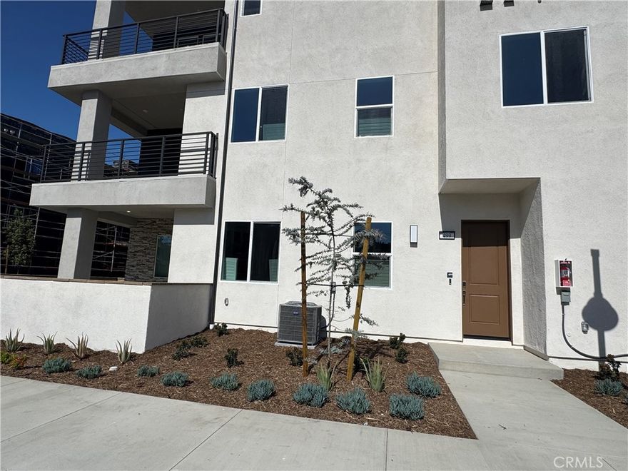 Come to see this pristine home located in the vibrant Luna Park neighborhood of Irvine's Great Park. This thoughtfully designed residence offers modern living with top-tier amenities and a functional layout.

One spacious bedroom downstairs with a full bathroom, ideal for guests or a home office. Upstairs you will find a luxurious primary suite featuring a private bathroom, alongside a secondary bedroom with its own bathroom. An open-concept loft upstairs offers versatile space for a media room, play area, or additional office space.

Brand new kitchen is Equipped with brand-new GE appliances, including a refrigerator, washer, and dryer, known for their reliability and advanced features. Luxury vinyl flooring throughout the home provides durability, water resistance, and a sleek aesthetic.

Enjoy two expansive patios—one downstairs adjacent to the living room, perfect for al fresco dining and entertaining, and another upstairs loft, ideal for morning coffee or evening relaxation.

Direct access to a spacious 2-car garage, providing convenience and additional storage. 220V outlet in the garage, ready for electric vehicle charging. Solar panels installed to reduce energy costs and promote sustainable living.

Located just a short walk from Luna Park's upcoming 13-acre central park, set to open in summer 2025, residents will enjoy access to:
Two swimming pools
Clubhouse
Pickleball and basketball courts
Outdoor BBQ areas
Multi-use trails and green spaces

Additionally, the home is in close proximity to the expansive Orange County Great Park, offering a variety of recreational activities and events.

Ready to make this highly upgraded home yours? Schedule a viewing today!