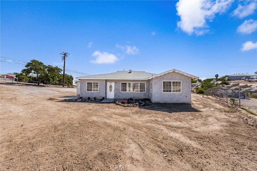 WONDERFUL Property has a GIANT LOT of 40,946sqft - This is PERFECT for the OWNER OPERATOR and HORSE LOVERS!!  This Home Offers Tons of Potential to Accommodate ALL of your Needs!! LOW, LOW Property Taxes and NO HOA Fees * * This is a Nicely UPGRADED & Improved Home with Room to Grow and Add Your Custom Work-Shop or ADUs * * Enjoy this SPACIOUS OPEN Floor-Plan offering 1362sqft with 4 Bedrooms & 2 FULL Bathrooms * * Great Kitchen with GRANITE SLAB Counters, Custom Cabinetry w/Glass Inserts, Tiled Floors, Breakfast Counter and In-Kitchen Dining Area * * Large Living Room with Ceiling Fan and Recessed Lighting * * Primary Bedroom with Beautiful Tiled Floors and PRIVATE Bathroom * * (3) Additional Nicely Appointed Bedrooms * * Upgraded Throughout Granite Counters, Ceiling Fans, Recessed Lighting, Custom Tiled Shower, Leaded Glass Front Door and MUCH MORE * * Great RURAL Location to Provide that Country Atmosphere & Lifestyle - GIANT Flat Lot is FULLY FENCED and Offers a Striking Rock Formation Creating a Natural Waterfall with the Seasonal Rain Showers * * Close to Schools, Shopping and EZ Freeway Access for the Commuter!!