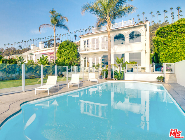 A rare Santa Monica beachfront estate with sweeping panoramic views that span from Palos Verdes to Malibu. This Spanish Colonial Revival is prominently situated on the legendary Gold Coast. The property features classic elements with what one would expect from today's modern luxury living. Enter this elegant sanctuary through a courtyard, high ceilings throughout adorn generously sized living spaces. The master suite enraptures breathtaking ocean views, a huge master bath, and walk-in closets. Three kitchens and a separate guest house accommodate hosting guests or staff. Private collector's 6-car underground parking garage. Large private pool and grassy backyard are just footsteps from the sand. Nearby the famous Santa Monica Pier, Third Street Promenade, Santa Monica Place, farmer's market, world-class restaurants, shopping, and entertainment.