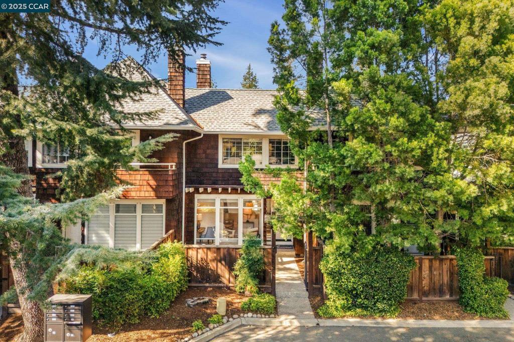 Step through a private, storybook gate into your own charming front patio—perfect for soaking up the California sunshine. With only 7 homes in this boutique community, the setting feels more like Carmel or Cape Cod—intimate, inviting, and full of character. Inside, the open-concept first floor features recently installed luxury vinyl flooring, a welcoming living room with a ledger stone accent wall, a dining area, powder room, and a cheerful kitchen with sliders leading to the private backyard—ideal for intimate entertaining. A cozy office/sunroom with oversized windows offers the perfect spot to work from home or curl up with a book. Upstairs, you’ll find two oversized ensuite bedrooms, each filled with natural light thanks to skylights in both bathrooms and the hallway. Convenience continues with an upstairs laundry. An oversized 28-foot garage with attic storage is a rare bonus, providing incredible space. Low HOA! The location can’t be beat—just blocks from BART for easy commuting, and minutes to downtown Walnut Creek’s shopping, dining, and entertainment.