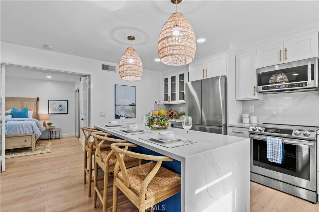 COASTAL CHARM MEETS MODERN COMFORT BY STRANDS BEACH!
Experience the ultimate in SoCal luxury living with this stunning 1-bedroom, 1-bathroom single-level corner unit, located just steps away from world class Strands Beach. This beautifully designed lower-level unit combines comfort, style, and an unbeatable location.
Inside, you'll find a light-filled living space, gorgeously remodeled kitchen with quartz countertops and a large island with double waterfall sides. The private patio offers a perfect spot for drinking your morning coffee with ocean breezes or relaxing after a day at the beach. The large master bedroom offers a serene retreat, while the full bath and well-appointed kitchen make everyday living effortless.
Set in the highly sought after coastal community of Niguel Beach Terrace, with lush landscaped grounds, residents enjoy amenities like a sparkling pool and spa--all walking distance from Dana Point Harbor, the Lantern District, shopping, dining, and coastal walking trails. Whether you're looking for a full-time residence, weekend getaway, or an investment property, this beautifully designed condo delivers the best of SoCal coastal living, in an unbeatable location.