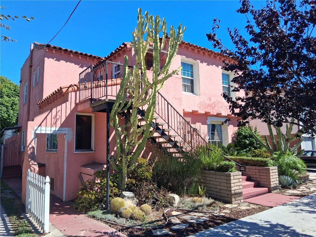 Exclusive listing in Long Beach's 90802 area. This 3-unit triplex offers two 2-bedroom/1-bath units and one 1-bedroom/1-bath unit with a patio and gazebo. The property includes parking for at least six vehicles and is located near 4th Street and Retro Row. Each unit is separately metered for utilities. The building is eligible for the Mills Act, offering property tax benefits.