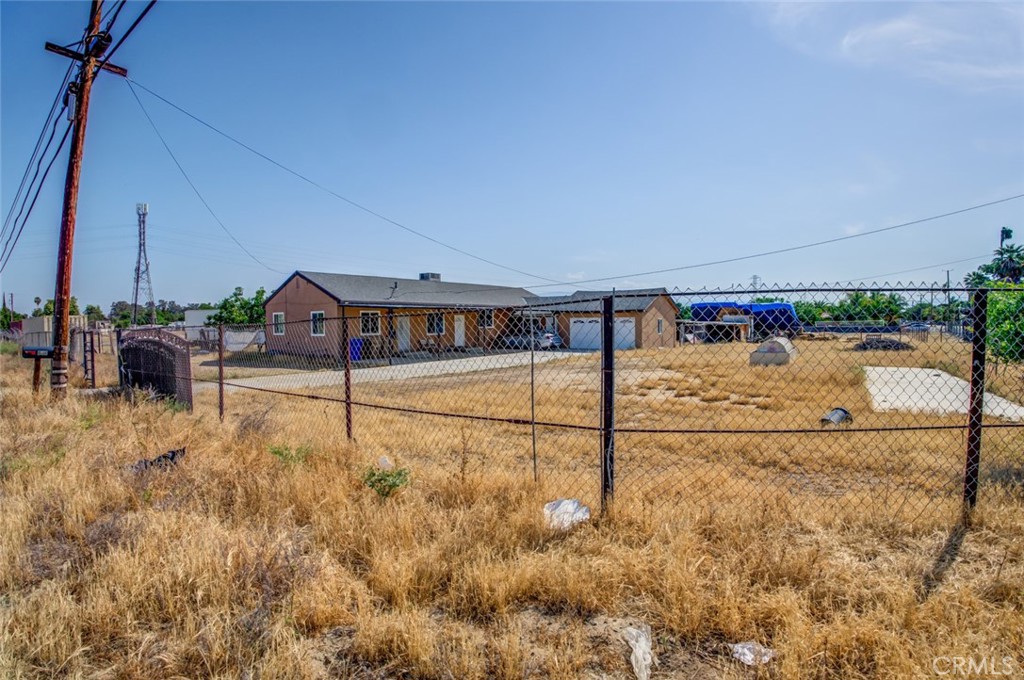 Explore the possibilities with this versatile 3-bedroom, 2-bath home situated on a sprawling 35-acre lot. This spacious residence features several updates and upgrades tailored for comfortable farm living. Inside, you’ll find a generous living area, a bonus room, and an indoor utility room complete with an additional kitchen—ideal for multi-functional use or extended family living. The layout is thoughtfully designed to accommodate tenant housing, with common areas that offer both privacy and shared space. Additional highlights include carport parking and an oversized two-car garage equipped with extra washer/dryer hookups. The property is zoned for agricultural use, yet offers flexibility with the potential to be subdivided into 1/4-acre lots. It’s also zoned for manufactured homes, making it a great opportunity for investors or those seeking long-term development potential.