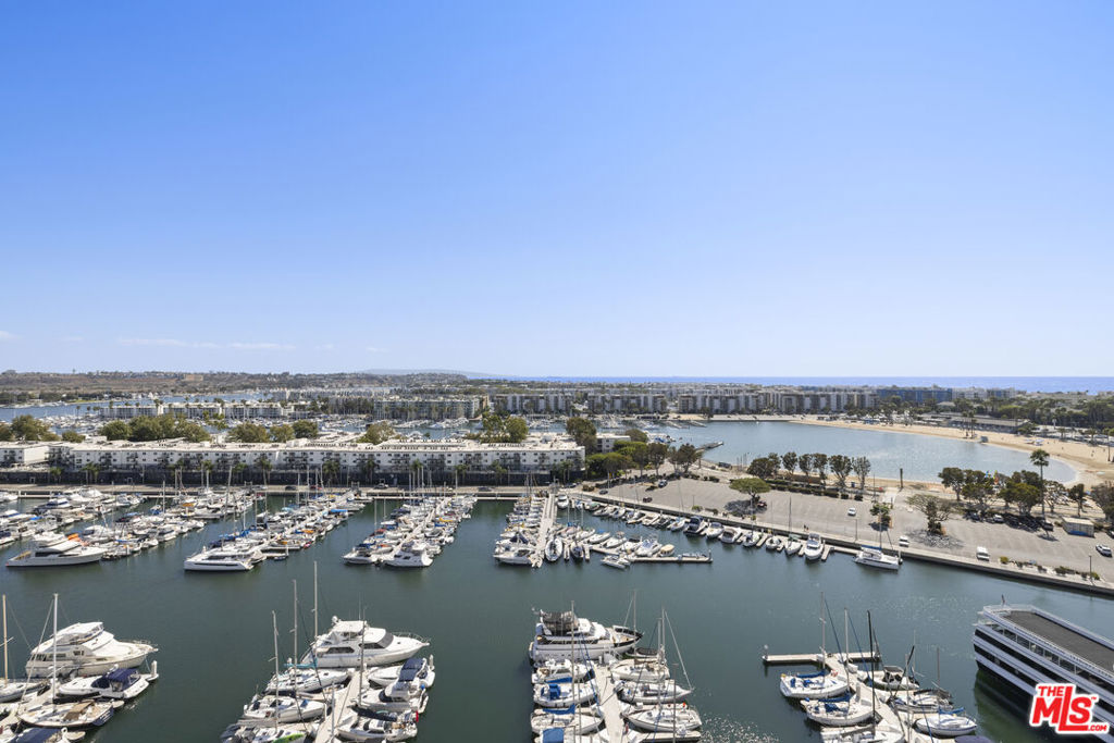 Luxury Penthouse with Panoramic Marina & Ocean Views. Live above it all in this stunning two-story penthouse at the iconic Marina City Club. Right as you enter you will be met with a bright living area and bar downstairs, that are perfectly set against grand floor-to-ceiling windows highlighting an unmatched panoramic views of the Marina, Pacific Ocean, and Catalina Island sunsets. This fully renovated 3-bedroom penthouse features an open floor plan, modern kitchen, spacious living and dining areas and a large balcony perfect for entertaining. Upstairs, a dramatic staircase leads to the master suite and two additional bedrooms. Dual entrances and an in unit tube elevator provide the ultimate comfort and convenience. Resort-style amenities include 6 tennis courts, 3 pools, racquetball, pickleball, a 16k sqft fitness center with complimentary classes, on-site restaurant and bar with room service, beauty studio, market, maid and dry cleaning services, car wash, and 24-hour security. Experience the ultimate blend of luxury, lifestyle and location.