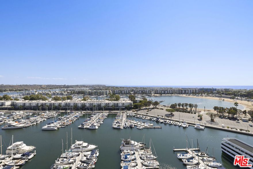 Luxury Penthouse with Panoramic Marina & Ocean Views. Live above it all in this stunning two-story penthouse at the iconic Marina City Club. Right as you enter you will be met with a bright living area and bar downstairs, that are perfectly set against grand floor-to-ceiling windows highlighting an unmatched panoramic views of the Marina, Pacific Ocean, and Catalina Island sunsets. This fully renovated 3-bedroom penthouse features an open floor plan, modern kitchen, spacious living and dining areas and a large balcony perfect for entertaining. Upstairs, a dramatic staircase leads to the master suite and two additional bedrooms. Dual entrances and an in unit tube elevator provide the ultimate comfort and convenience. Resort-style amenities include 6 tennis courts, 3 pools, racquetball, pickleball, a 16k sqft fitness center with complimentary classes, on-site restaurant and bar with room service, beauty studio, market, maid and dry cleaning services, car wash, and 24-hour security. Experience the ultimate blend of luxury, lifestyle and location.