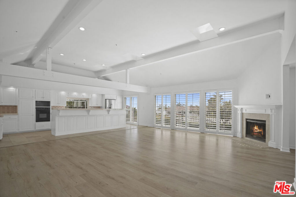 Step into classic Malibu living with this 4-bedroom, 3-bathroom Cape Cod-style home, located in the desirable Broad Beach community. Positioned adjacent to the sands of Sea Level Beach, this inviting residence places the surf and shoreline right at your fingertips. Nestled on a quiet cul-de-sac, the home features a bright, open floor plan with high ceilings, hardwood floors, and a cozy fireplace in the spacious living room. A generous balcony offers ocean views perfect for morning coffee or evening sunsets. The kitchen seamlessly connects to both the family and living areas, creating an effortless flow for entertaining or everyday comfort. The primary suite is a peaceful retreat with its own ocean-view balcony, large walk-in closet, and a en-suite bath and shower. Three additional bedrooms provide flexible space for guests, family, or a home office. Enjoy a private fenced backyard, a grassy front lawn, and a two-car garage with abundant storage. Conveniently close to Trancas Country Market, Zuma Beach, and Malibu's top-rated schools, this is an exceptional opportunity to lease or own a classic coastal home in one of Malibu's most desirable neighborhoods.