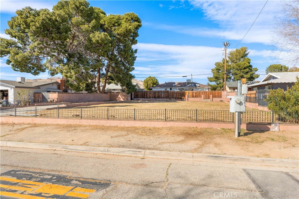 Discover an exceptional opportunity to build your dream home on this development-ready residential lot in the heart of Rosamond, California. This prime parcel comes complete with existing utilities, eliminating a significant hurdle in the construction process. The standout feature of this property is its enviable location directly facing Rosamond Park, offering future residents permanent green space views and easy access to outdoor recreation.
Situated in a well-established neighborhood, this lot provides the perfect canvas for your custom home design. The convenient proximity to the Highway 14 corridor ensures easy connectivity to surrounding areas while maintaining a peaceful residential setting. The location strikes an ideal balance between accessibility and tranquility, making it particularly appealing for those seeking a suburban lifestyle with urban conveniences nearby.
The property's position near Edwards Air Force Base makes it an excellent choice for aerospace professionals and their families. The surrounding community of Rosamond offers a blend of small-town charm and modern amenities, with local schools, shopping, and dining options within easy reach.
This vacant lot presents a rare opportunity to create a personalized living space in a desirable location. With utilities already in place and the necessary infrastructure ready, you can focus on bringing your architectural vision to life. Don't miss this chance to establish roots in a growing community with a promising future.