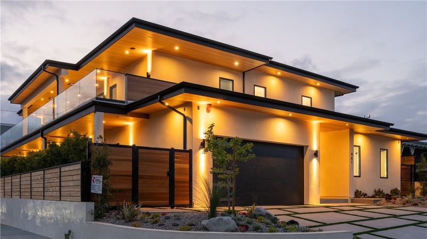 Located in the highly coveted Poet’s Section of Manhattan Beach, this newly built coastal contemporary residence is a stunning blend of architectural elegance and refined design. Created by a distinguished local builder Fasano Enterprise, Inc. This home offers sweeping ocean views and sophisticated indoor-outdoor living.



The open-concept layout features 10-foot ceilings, French white oak flooring, natural stone fireplaces, and custom rift oak doors throughout. A 24-foot La Cantina glass wall opens to a 700 sq. ft. terrace with a Hot Tub + Cold Plunge, cedar-lined sauna, built-in ceiling heaters, and integrated speakers—perfect for elevated outdoor enjoyment.



The chef’s kitchen is equipped with a 10-foot island, walk-in pantry, and 16-foot wet bar, ideal for culinary creativity and entertaining. A floating staircase with a dramatic 20-foot stone wall leads to the lower level, where four generously sized bedrooms are situated, including a luxurious primary suite with access to a serene garden retreat.



The landscaped backyard is framed by a custom pergola and lush greenery, offering a peaceful and private setting. Close proximity to beaches, dining, shopping, and highly regarded schools enhances the appeal of this exceptional home.