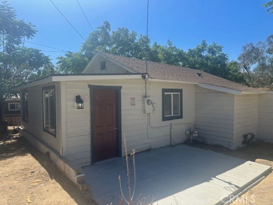 TURNKEY!!!!!Two Bedroom 1 bath 2 Car garage on half an acre new roof new kitchen Cabinets new appliance new mini split new laminate flooring and carpet new paint inside and out close to school and parks This is a must see!