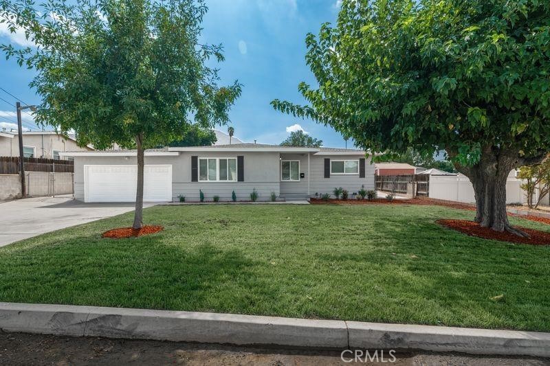 WOW, More than 1/4 ACRE!!! This REMODELED HOME is One of the Cheapest 4 bedroom homes in Grand Terrace!!! FHA, CONV, VA OK!! This house has it all. It has NEW interior paint, NEW Exterior Paint, NEW wood laminate flooring, NEW remodeled kitchen with NEW counter tops, NEW backsplash, NEW stainless steel stove, NEW microwave, NEW remodeled bathroom, NEW vanity cabinets, NEW irrigation system, Central A/C and Heat, NEW interior texture, NEW electrical fixtures, NEW plumbing fixtures, NEW doors and moldings, AND MUCH MORE. Hurry, this one won't last long