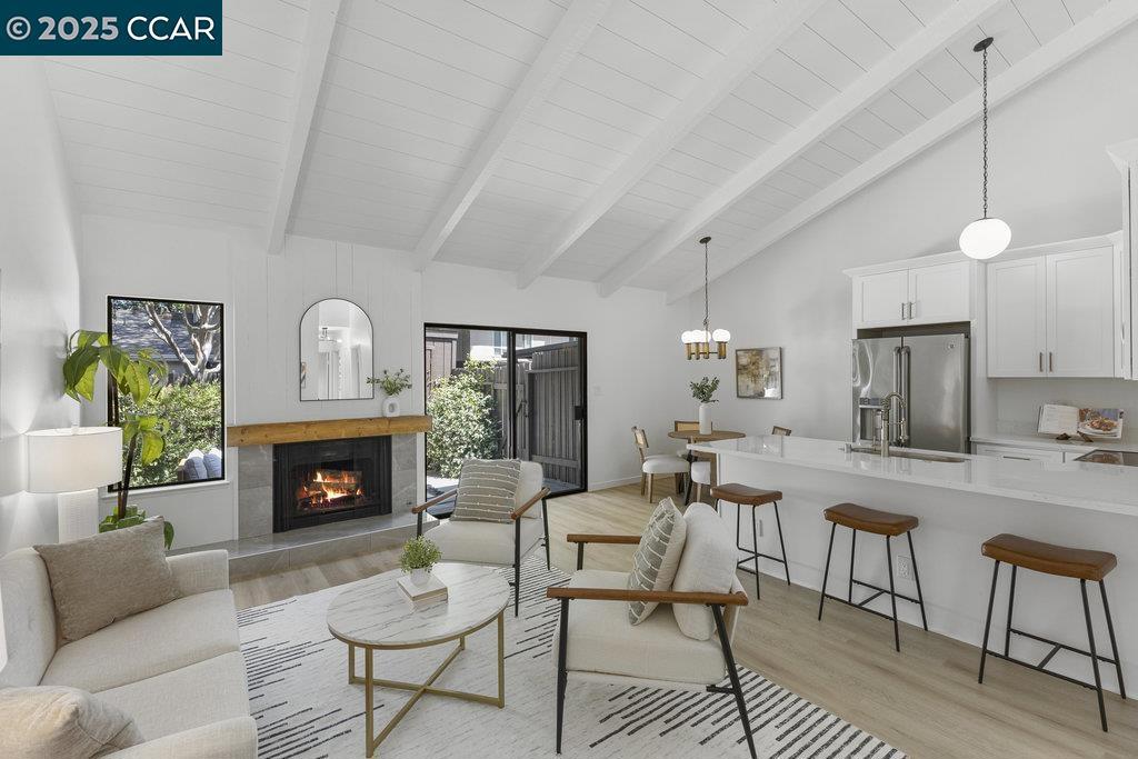Beautifully Renovated Townhome in Prime Walnut Creek Location This extensively renovated, single-story, end-unit townhome blends contemporary design with everyday comfort in one of Walnut Creek’s most desirable neighborhoods. The light-filled interior features soaring vaulted ceilings, new flooring, and new paint throughout. The kitchen has been completely reimagined with updated finishes, while the spa-like bathroom offers a calming retreat. A custom fireplace surround anchors the stylish living area, and the in-unit laundry, dedicated covered parking space, and extra storage in the private yard add layers of convenience. Enjoy indoor-outdoor living with a private, enclosed patio that feels like a personal oasis—perfect for morning coffee. The home is set in a peaceful, greenbelt-lined enclave that includes access to a community pool and clubhouse. Right across the street, the Iron Horse Trail invites daily strolls, bike rides, and a deep connection to the natural beauty of the area. This location also offers easy access to downtown Walnut Creek’s shopping, dining, and entertainment, plus quick freeway access. Zoned for top-rated schools. Ask about the amazing mortgage rate buy down available for this property!
