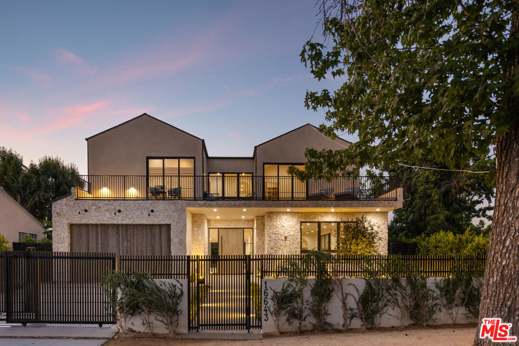 Welcome to 16643 Addison Street, an exquisite modern retreat in the heart of Encino that blends architectural elegance with warm livable comfort. Recently undergoing an extensive remodel, this home features light-filled interiors with soaring ceilings, wide-plank oak flooring, and an open-concept layout where the gourmet kitchenwith sleek custom cabinetry, premium stainless steel appliances, and an expansive islandflows seamlessly into the dining and living areas accented by designer lighting and a grand fireplace. Spacious bedrooms offer serene color palettes and luxurious finishes, while spa-inspired bathrooms showcase designer tile, floating vanities, and high-end fixtures in brushed gold tones. Multiple living spaces, including a versatile home office overlooking the pool, provide flexibility for today's lifestyle. An attached 1-bedroom, 1-bathroom ADU offers a private retreat for guests, extended family, or potential rental income. Outside, the private backyard is an entertainer's dream with a sparkling pool and spa, sun-soaked lounging deck, cozy firepit, and built-in barbecue surrounded by mature landscaping for privacy. Perfectly situated near fine dining, upscale shopping, and top-rated schools, this stunning home offers the ideal blend of modern sophistication and California comfort.