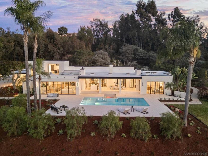 This Brand-NEW Luxury Estate was built for living well. Nestled within the gates of the exclusive Rancho Valencia Five Star Resort community, this fully renovated custom estate offers the rare combination of resort luxury and absolute privacy. Set on 2 expansive, usable view acres, the home commands panoramic vistas while still being a short stroll from world-class Spa, Dining and Tennis amenities. The layout encourages seamless transitions between interior & exterior. Every element has been reimagined to deliver a Timeless Modern Resort aesthetic. Entertain on covered patios, dine al fresco beneath the stars, or retreat to intimate spaces. You will love the generous open living, dining and kitchen plus great flex spaces, private suites and ultra luxe amenities throughout.  This estate was built for living well. Whether as a primary residence or second home, it offers a quiet sanctuary with a resort feel. Within the Rancho Valencia enclave, homeowners enjoy privileged access to spa services, tennis facilities, fine dining, and wellness programs - all within walking distance. * Homes in Rancho Valencia rarely come to market, and few of this level of total renovation, acreage and privacy. Welcome to 6067 Paseo Valencia, Rancho Santa Fe.