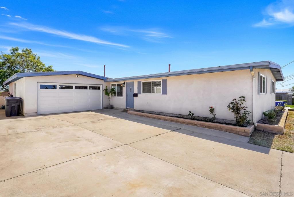 Beautiful 4/2 bathroom home featuring tile floors, large kitchen, dual pane windows, new countertops and backsplash, upgraded ss appliances, new carpet in bedrooms, and a huge yard. Also a large driveway for plenty of parking for cars, RVs, or toys. On 7100sqft lot, the back yard is nice and open, and big enough for a pool or adu. Permitted extra room behind garage. Conveniently located next to shopping, schools, and parks.