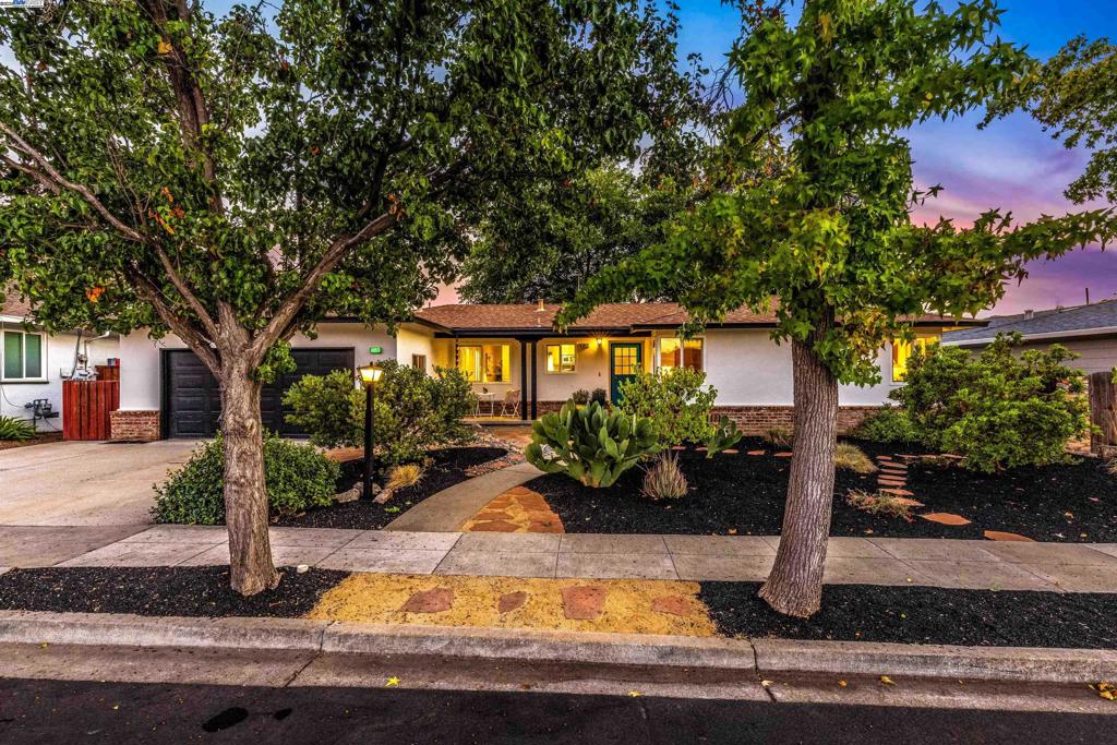 Come embrace and enjoy midcentury modern living at 3857 Pestana Way! For more than 30 years, the proud owners have created their own oasis, including professional landscaping with all native plants, drought-resistant front and back yards, and custom interior touches throughout. This well-maintained home includes recent upgrades such as a newer HVAC system, a newer hallway bathroom and kitchen, built-in hallway cabinetry, dual pane sliders in the great room, dual pane windows (in most rooms), and an upgraded main electrical panel, plus much more. The fantastic floor plan is perfect for today's family living and tomorrow's entertaining, with space where you need it. This includes an expansive great room, an eat-in kitchen nook, and a separate bedroom and full bathroom with their own door for multigenerational or au pair living. Easy living is offered with a two-car attached garage featuring fresh exterior and interior paint in designer colors. Create wonderful family memories in one of the best neighborhoods in Livermore! This outstanding location is near so much, not far from downtown, and close to the Chardonnay Plaza with shopping and restaurants. Public transportation is also nearby. Open Thursday 10-1, Saturday and Sunday 1–4! Don't miss this one!