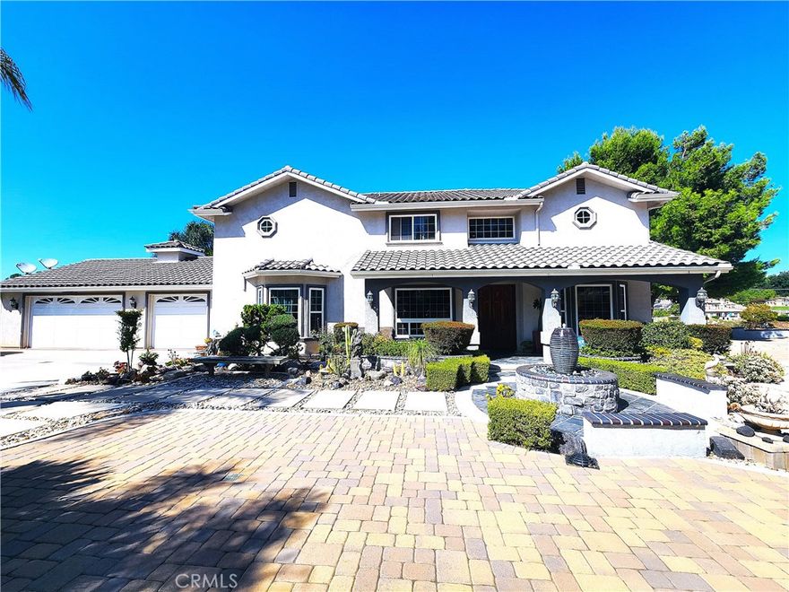 Welcome to your dream home nestled in one of Temecula’s most sought-after neighborhoods. This custom-built residence offers a harmonious blend of elegance, comfort, and scenic beauty. Professionally landscaped grounds frame the property, showcasing breathtaking country views that set the tone for tranquil living. Step into a grand entry foyer that opens to a spacious family room on the right and a formal dining room on the left—perfect for entertaining. Beyond the foyer lies an expansive Family room featuring soaring vaulted ceilings, a custom-built entertainment center with rich cabinetry, and a cozy & fireplace with a hearth that invites relaxation. The gourmet kitchen is a chef’s delight, adorned with custom Cherrywood cabinetry, gleaming granite countertops, and a walk-in pantry for ample storage. Imported hardwood flooring complements the cabinetry throughout the home, while plush carpeting adds warmth to the Livingroom and den areas on the main level. A conveniently located laundry room sits just off the kitchen. The main floor includes a generously sized bedroom and full bathroom—ideal for guests or multigenerational living. Ascend the stunning Cherrywood staircase to discover four additional bedrooms and a spacious loft, all carpeted for comfort with central Vacuum system. The luxurious master suite features an en-suite bathroom with a Jacuzzi tub, walk-in shower, dual granite vanities, and a large walk-in closet. From the second-floor bedrooms and loft, enjoy sweeping views of the serene countryside. Designed for year-round enjoyment, the backyard and side yard are an entertainer’s haven. Gather around the outdoor fireplace or firepit, dine al fresco at the built-in BBQ and counter area, and host unforgettable gatherings under the stars. The property also includes RV parking with space for two large vehicles. Step outside your door and onto miles of scenic walking trails. Meadowview offers residents access to 380 acres of open space, 23 miles of trails for hiking, biking, and horseback riding, plus resort-style amenities including pools, a spa, kiddie pool, tot lot, picnic areas, and courts for basketball, tennis, and pickleball. Equestrian enthusiasts will appreciate the arena and round pens. This exceptional property offers a rare opportunity to enjoy luxurious country living with all the conveniences of a vibrant community. Paradise is not a destination—it’s your new home.
