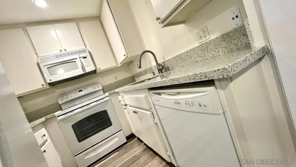 LOCATION! LOCATION! LOCATION! This unit is by far one of the best locations in the complex facing the back with a nice open view and away from all street noise. Upgraded AC unit, flooring, kitchen countertops/sink/faucet, paint, and etc. Enjoy the social events/gatherings/exercise room/clubhouse & more. Walk to shopping, restaurants and easy freeway access. One resident must be 62+