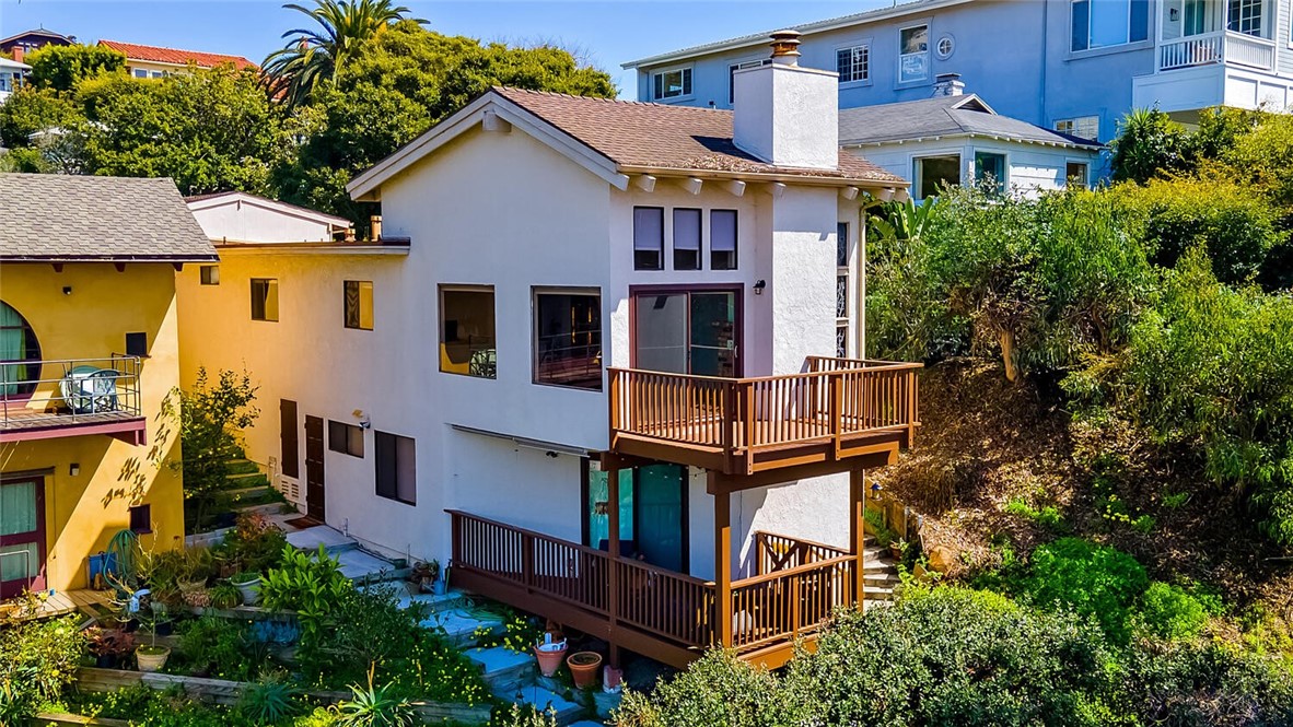 Nestled in the vibrant heart of downtown Laguna Beach, this majestic home showcases breathtaking ocean, coastline, and city light views. Offering 3 spacious bedrooms and 2.5 bathrooms, the residence features the unique flexibility of two separate living spaces—perfect for guests, extended family, or a private home office.
The open-concept Great Room boasts soaring ceilings, a romantic fireplace, and original stained-glass windows, creating a rare blend of character and charm. A large carport and driveway accommodating up to 4 vehicles provides convenience rarely found in this location.
Step outside and enjoy being just moments away from the world-renowned festivals, Playhouse, Suzy Q Center, boutique shopping, fine dining, and art galleries. Hop on the free trolley to explore the many coves and beaches along the iconic California Riviera.
This one-of-a-kind Laguna Beach property perfectly balances coastal charm with downtown convenience—a true gem in one of Southern California’s most sought-after destinations.