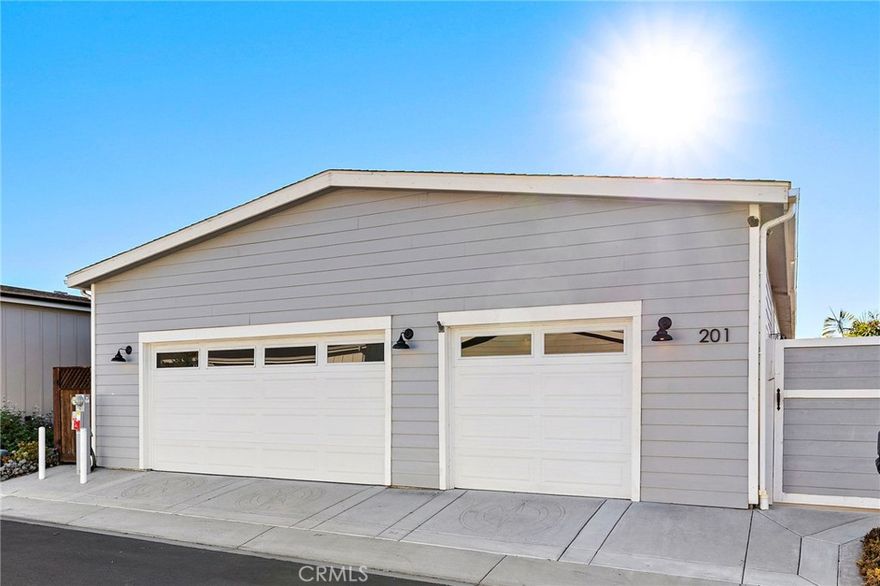 Rare opportunity to own a beautiful, newer manufactured VIEW home in a premier coastal 55+ community — and you own the land, with no space rent. Golf course, canyon, and peek-a-boo ocean views surround this stunning 3 bedroom, 3.5 bath residence, complete with a highly desirable 3-car garage.
Located in Shorecliffs Terrace, an active 55+ community known for its social activities, wonderful HOA amenities, and close proximity to the beach, this home sits in the coveted newer section of the neighborhood — just 24 lots sold between 2017–2018. The warmth, charm, and quiet feel of this cul-de-sac street are unmatched. 
Inside, enjoy a large light-filled kitchen that opens seamlessly to the living and dining areas, offering endless possibilities and direct access to the back patio and captivating views. The primary suite includes a spacious walk-in closet and en-suite bath with a double-sink vanity. Two guest bedrooms share a bathroom, separating the two bedrooms, and an additional powder room serves the main living area.
The expansive 3-car garage is a standout feature, providing exceptional storage, built-in cabinetry with a sink, a TV setup, and even a full bath. Outdoors, the back patio offers gorgeous views with space to relax, along with a retractable awning for shade when needed. Solar is on this home, central A/C and heating, beautiful kitchen and baths, breathtaking views, all combined in easy one level living.
This is a very special community in the beautiful coastal town of San Clemente. Come experience the comfort, views, and vibrant lifestyle that Shorecliffs Terrace has to offer.