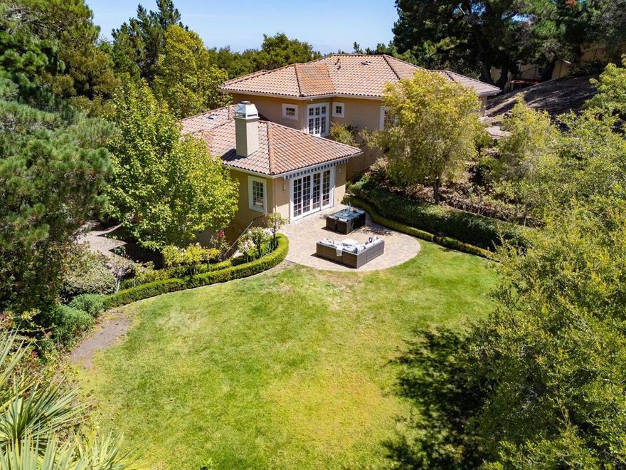 This luxurious 2001-built home in the prestigious Lakeview neighborhood of Hillsborough sits on a gated 0.6-acre lot, offering a serene yet convenient retreat just minutes from the 280 Freeway, 30 minutes from both San Francisco and Silicon Valley, and 15 minutes from SFO. The interior features high ceilings, recessed lighting, crown molding, wainscoting, gleaming hardwood floors, chandeliers, and luxurious fixtures that all project class and sophistication. Large windows flood the home with natural light, creating a bright and airy ambiance that flows seamlessly throughout. The gourmet kitchen boasts top-tier appliances including a built-in Subzero® refrigerator, Thermador® rangetop, double wall ovens, a Miele® microwave, and a wine cooler in the large center island. At the same time, the expansive backyard is perfect for entertaining. The home includes five en-suite bedrooms, a grand primary suite, a wine cellar, and a three-car garage, making it an exceptional blend of luxury and convenience.