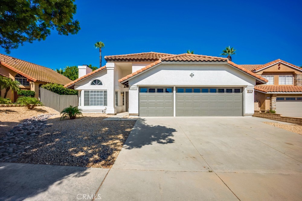 This beautifully upgraded 4-bedroom, 2-bathroom home combines comfort, functionality, and modern style. Step inside to find fresh new paint and brand-new flooring throughout, creating a clean and inviting space. The upgraded kitchen offers plenty of cabinet space and modern finishes, making it ideal for both everyday cooking and entertaining. The open layout is filled with natural light, giving the home a bright and airy feel. The spacious primary suite features a walk-in closet and a double-sink vanity in the bathroom for added convenience. Outside, enjoy a low-maintenance front yard and a private backyard with a covered patio perfect for relaxing or hosting guests. With a 3-car garage and a dedicated indoor laundry room, this home has everything you need and more. Move-in ready and waiting for you!