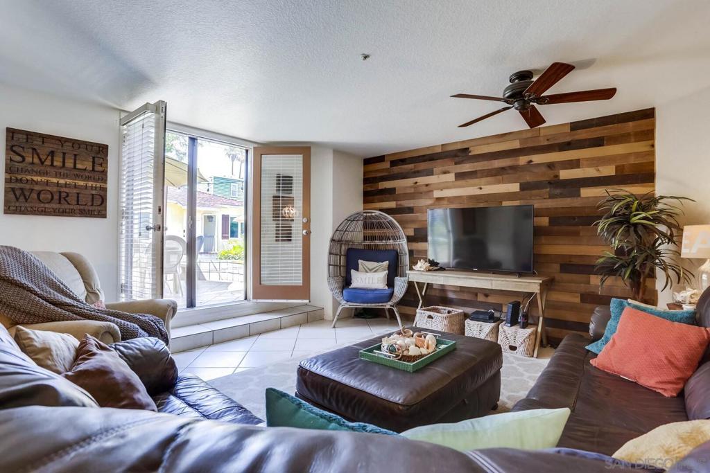 Welcome to the Bayside of Mission Beach in this beachy retreat called the Hidden Charmer! This modern 2BD/2BA ground floor condo is beautifully decorated with a bright and cheery seaside theme. Enjoy the peaceful South Mission Beach area from your own vacation rental, steps to the waterfront. With an open floorplan, this home is ideal for entertaining, inside and out. French doors open from the living room onto an elevated patio where you'll relax while cooking on the BBQ grill for the family. Enjoy the large, kitchen with island to continue the conversation while enjoying the chef's company. The spacious living room is equipped with a large flat screen TV and comfortable leather sofas. The newly remodeled kitchen has stainless steel appliances, and a marble topped island with room for three seats. The dining room can be viewed from the kitchen and living room with a table that can seat 6. The primary bedroom is a wonderful space, with oversize closets, large walk-in shower, and private facilities. You'll appreciate the ample storage in utility/laundry room off the garage where there's lots of room to organize. This home does not have air conditioning but like most coastal areas, the coastal breeze cools the home easily. This home includes a secured parking garage for two, tandem cars. GARAGE DIMENSIONS: 6'8" H x 7'11" W x 26'4" L. Please make sure your vehicle/s will fit within these dimensions. SLEEP ACCOMODATIONS: Primary - Queen Bed Bedroom 2 - Queen Bed