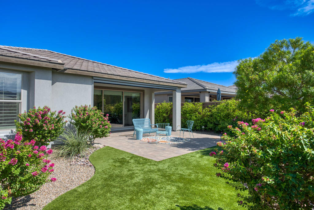 Immaculate Single-Story Home in Trilogy at the Polo Club - Where Luxury Meets Desert Living. Experience the perfect blend of sophistication and comfort in this beautifully upgraded 1,622 sq ft residence, ideally located in the highly sought-after Trilogy at the Polo Club. Designed for both relaxation and entertaining, this single-story gem offers 2 bedrooms, 2 bathrooms, and a versatile den--ideal as a home office, media lounge, or creative studio. Go inside to a bright, open floor plan enhanced by soaring 9' ceilings, stylish tile flooring in the main living areas, and an impressive 15' rolling glass wall that creates a seamless connection between indoor and outdoor living. The gourmet kitchen is a true centerpiece, boasting upgraded cabinetry, quartz countertops, upgraded stainless steel appliances, and a spacious island with bar seating--perfect for casual meals or hosting friends.The private primary suite is a serene retreat, featuring cozy new wool carpeting, dual sinks, a generous walk-in closet, and a custom designer shower for a spa-like experience at home. A second bedroom--also appointed with plush wool carpeting--and a full bath offer comfort and privacy for guests.Outdoors, the professionally landscaped, low-maintenance backyard is a peaceful oasis framed by paver patios and walkways. Whether sipping morning coffee under the oleander trees or enjoying evening breezes, this private space invites year-round enjoyment. A walking trail directly behind and beside the home enhances the sense of openness and privacy. An optional Polo Club Membership (transfer fee $1,875) unlocks access to a 25,000 sq ft clubhouse with a fitness center, resort and lap pools, tennis, pickleball, an indoor golf simulator, and the award-winning June Hill's Table restaurant--all set against the breathtaking backdrop of the Santa Rosa Mountains. This move-in ready home offers the ultimate in refined, active desert living--don't miss your chance to make it yours.