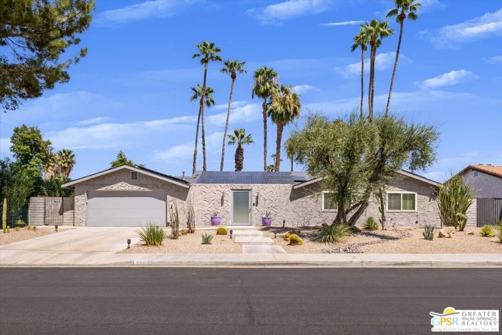 The hidden gem of South Palm Springs, Los Compadres Estates! This home defines "refined desert living". A major feature of Los Compadres Estates is the private and gated tennis courts, pickleball courts and large grassy area which is located just next door. This 4 bedroom 2 bath home has been extensively and beautifully updated. Once you enter the front gate there is a private and tranquil garden patio which sets the tone for the home. Inside the double front doors is an open concept living room and dining room with vaulted ceilings. Two sets of sliding glass doors flood these rooms with morning sun and create that indoor/outdoor Palm Springs lifestyle. The living room features a modern updated gas fireplace. Just off the dining area is a large den which features a wall of custom cabinetry providing lots of storage space and wine refrigerator. The updated (2010) chef's kitchen features soap stone counter tops, double ovens, 5 burner cook top, stainless appliances and abundant counter and storage space. Tile flooring gives cohesion to all of these areas. The ample sized primary bedroom is located at the back of the home with direct access to the pool/spa area. Primary en-suite is beautifully updated and features dual vanities, a large soaking tub and shower. The other 3 bedrooms, one currently being used as a home office, are just down the hall. They share a nice sized bathroom with a large glass tiled shower. All bedrooms are carpeted. The private backyard features multiple entertaining areas, pool/spa and mountain views. Los Compadres has no visible power lines or poles. Lots of additional updates include, A/C (2013), roof (2021), pool heater (2022), main swap cooler (2022) and all new dual pane windows. The 2 car garage has its own separate swamp cooler. Home has a leased solar system. All of this on LAND YOU OWN!