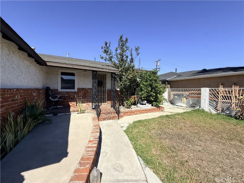 Photo of 717 E Santa Rita ST, Compton, CA 90220 (MLS # SW26221062)